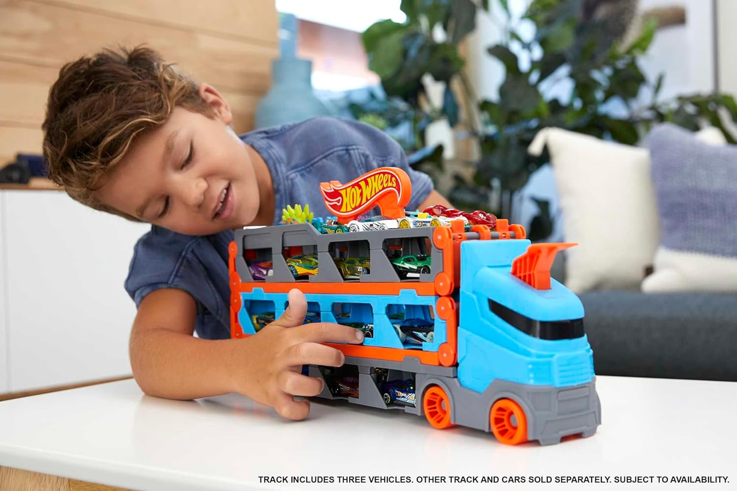 Hot Wheels - 2:1 Autorennbahn zu Transporter, inkl. 3 Spielzeugautos, mit Doppelstarter, Auslösefunktion und Weiche, Platz für 20 Autos, Spielzeug ab 4 Jahre